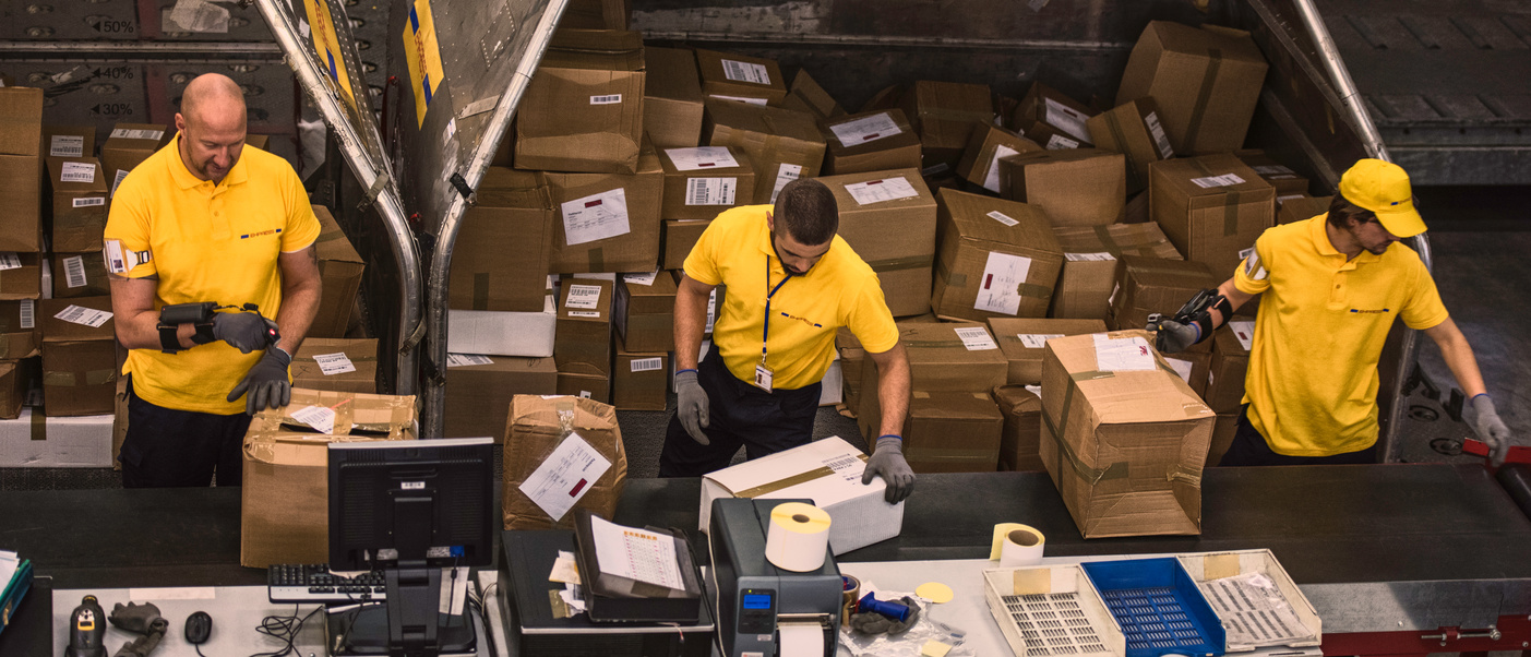 Warehouse workers examining packages